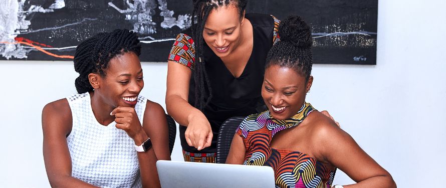 Three women researching Delta Dental Muskegon coverage on a laptop How Does Delta Dental Support Preventive And Comprehensive Dental Care