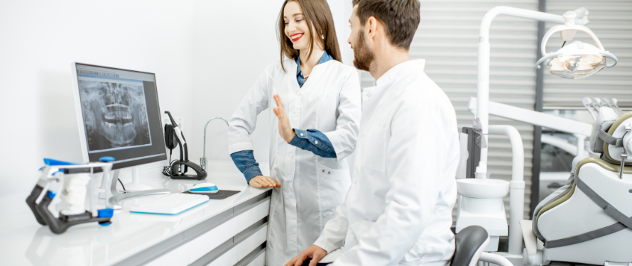 family dentist in Muskegon. Dentists reviewing X-rays together at a family dentist Muskegon practice.